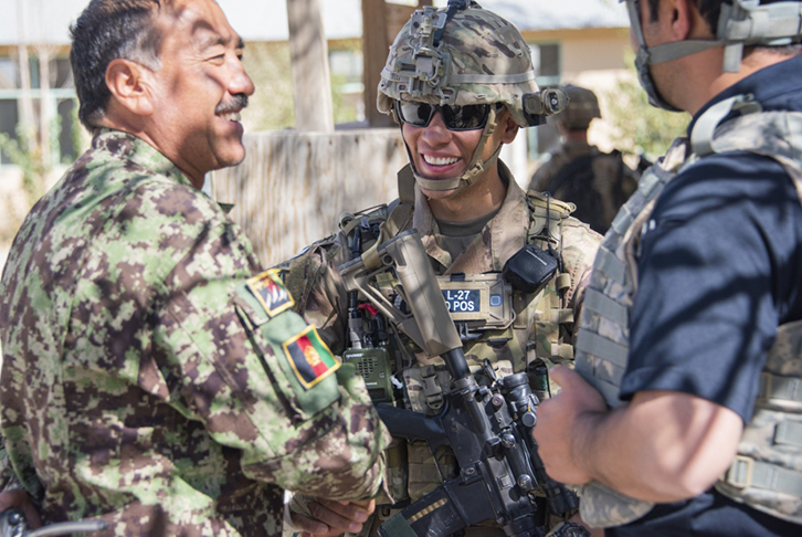 Sgt. 1st Class Jeremiah Velez, center, an advisor with the 1st Security Force Assistance Brigade’s 3rd Squadron, interacts with Afghan Command Sgt. Maj. Abdul Rahman Rangakhil
