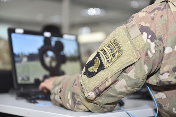 A U.S. Army Sapper, Ranger, and Airborne qualified Soldier assigned to the 101st Airborne Division, uses the Virtual Battle Space 3 (VBS3) system at the Joint Multinational Simulation Center’s Tactical Gaming division