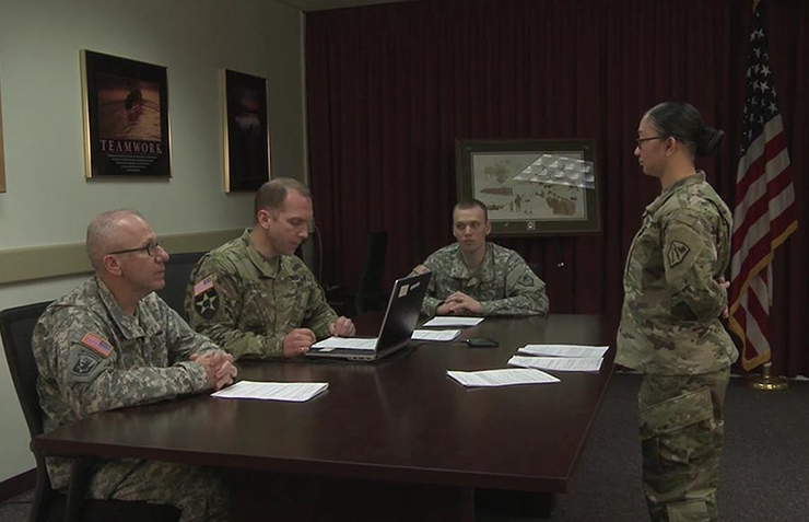 Soldiers participate in a training video intended to familiarize the Alaska National Guard force with nonjudicial punishment