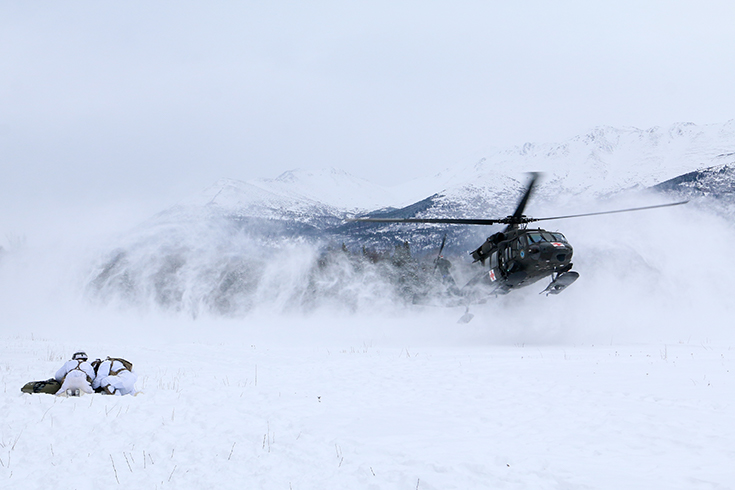 Paratroopers with 1st Squadron, 40th Cavalry Regiment (Airborne), 4th Infantry Brigade Combat Team (Airborne), 25th Infantry Division, U.S. Army Alaska, wait for a UH-60 medical-evacuation helicopter to land