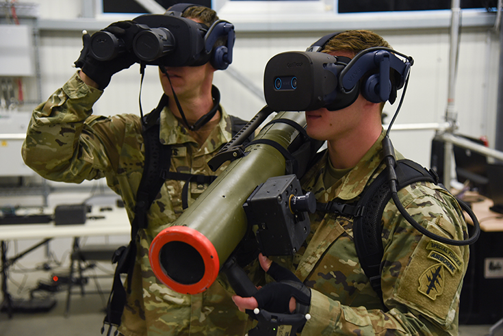 U.S. Army Sgt. 1st Class Adriana Fox disassembles her weapon.