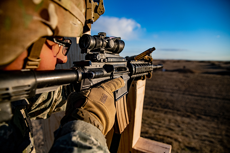 U.S. Army Staff Sgt. Joseph H. Miya fires an M4 carbine during a marksmanship qualification range