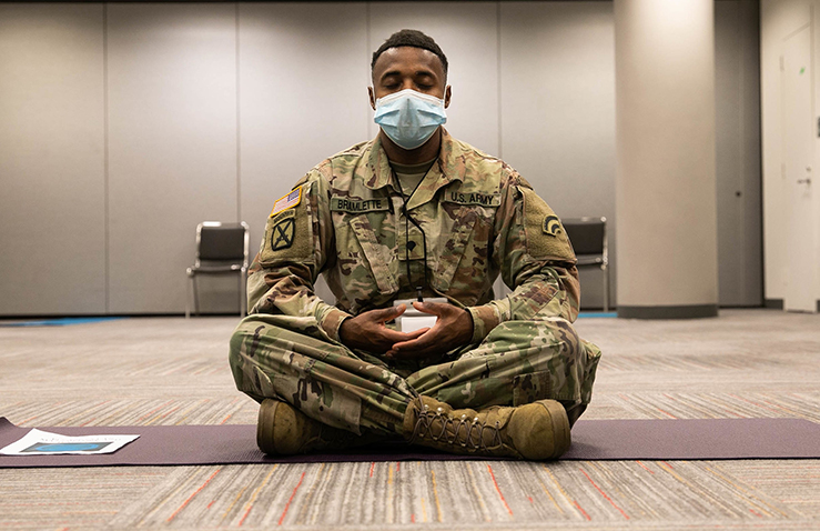 U.S. Army Spc. Kima Bramlette, 642nd Aviation Support Battalion, meditates during a lunch break