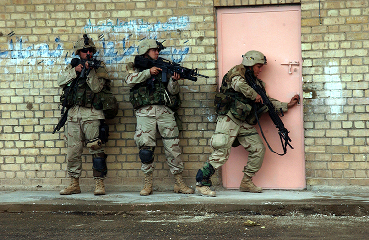 U.S. Army Soldiers enter a building in Fallujah