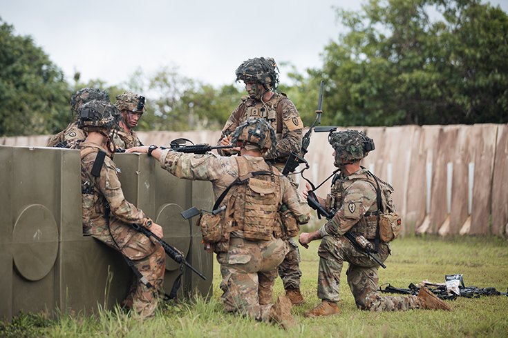 A senior NCO talks with Soldiers from the 3rd Infantry Brigade Combat Team