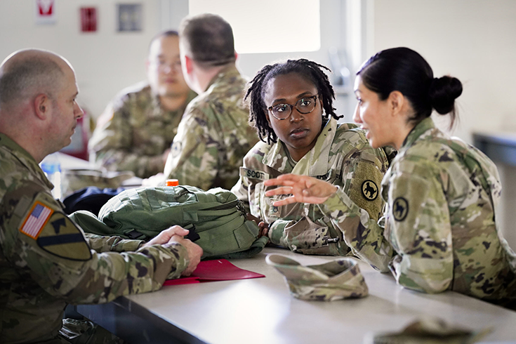 A Soldier chats with friends on social media before supporting the 59th Presidential Inauguration in Washington, D.C.