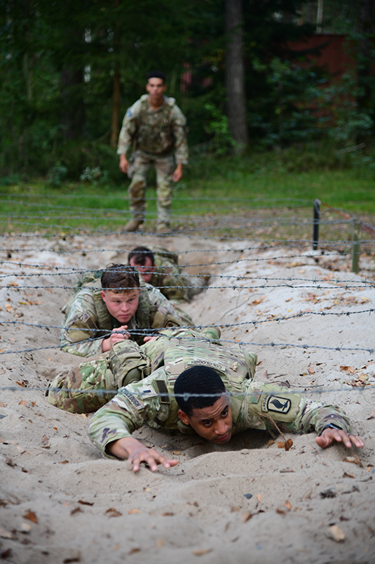 Paratroopers assigned to 173rd Airborne Brigade work together to conquer challenges during payday activities