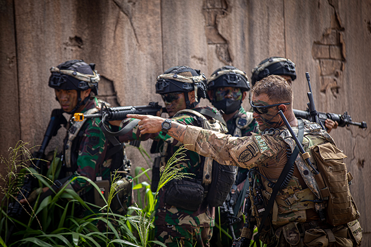 Staff Sgt. Jeremy Mireles, 5th Security Force Assistance Brigade Maneuver Advisor Team 5211, suggests a ground maneuver for Tentara Nasional Indonesia Angkatan Darat Soldiers