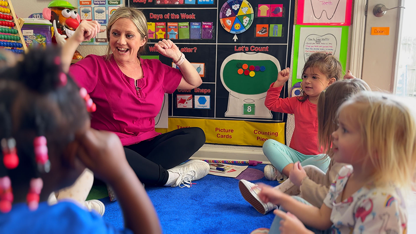 A Family Child Care provider sings with children during circle time at Fort Campbell, Kentucky, Feb. 8, 2024