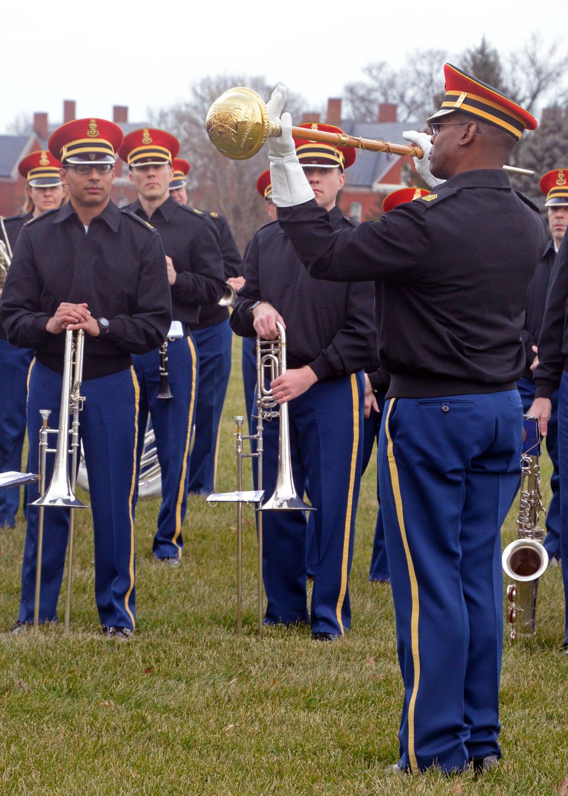 Sgt. Maj. Julian R. Ayers Sr., the drum major for U.S. Army Band “Pershing’s Own,” demonstrates baton moves he will use during a rehearsal on Summerall Field at Fort Myer, Virginia. The band was preparing for the inaugural parade. (Photo by Jonathan (Jay) Koester / NCO Journal)