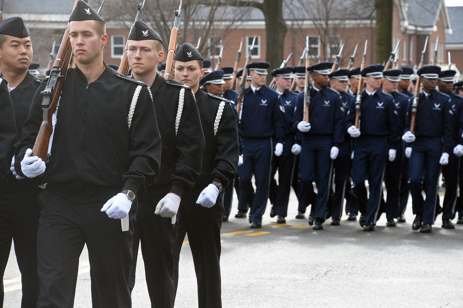 Following the U.S. Army Band “Pershing’s Own,” members of military rifle guards march down Sheridan Avenue during a rehearsal at Fort Myer, Virginia. The groups were preparing for the inaugural parade. (Photo by Jonathan (Jay) Koester / NCO Journal)