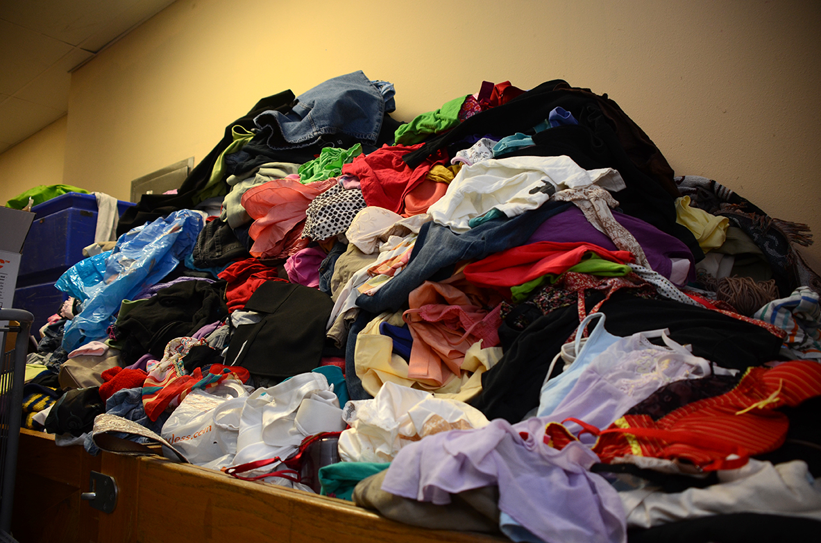 Before, junior enlisted and their families had to pick through piles of donated clothing, such as the one above, in order to find what they needed. “That is not an image you want to see,” said Mike Menold, the project lead. (Photo by Meghan Portillo / NCO Journal)