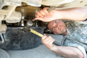 Private First Class Derrik Steinebach, a member of Nemier’s crew within J Forward Support Company, 2nd Battalion, 8th Cavalry Regiment, 1st Armored Brigade Combat Team, 1st Cavalry Division, repairs a fuel leak on a Bradley fighting vehicle. (Photo by Meghan Portillo / NCO Journal