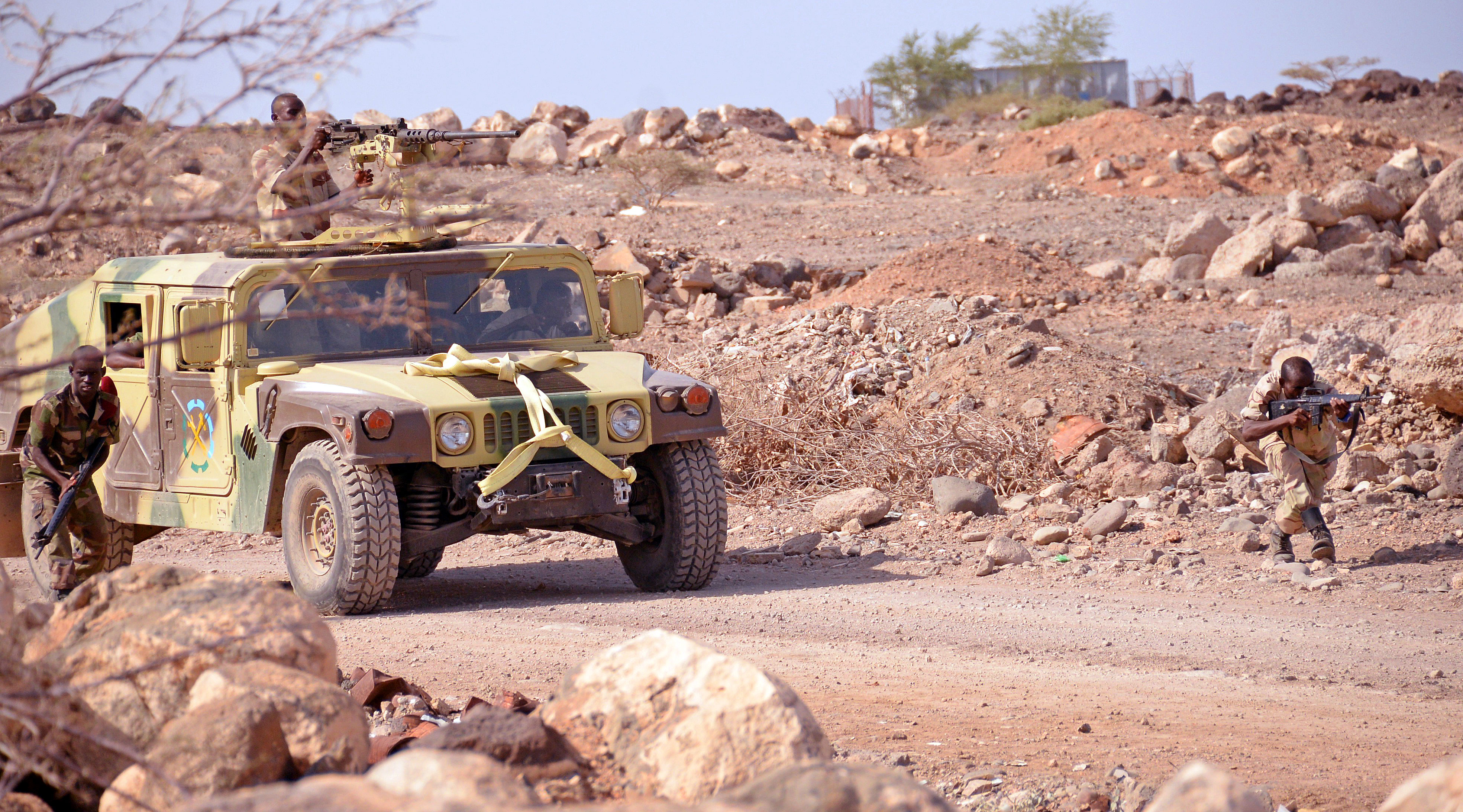 During a culminating event after five months of training, Djiboutian army soldiers approach a roadblock.