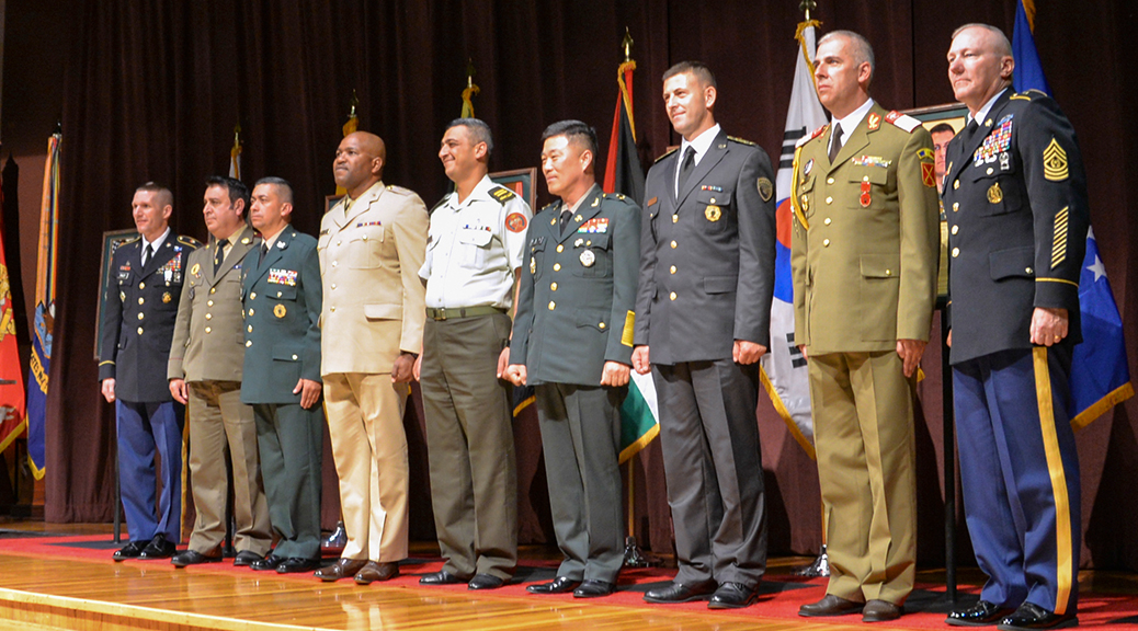U.S. Sgt. Maj. of the Army Daniel A. Dailey, left, and Command Sgt. Maj. Dennis Defreese, commandant of the U.S. Army Sergeants Major Academy inducted seven into the International Student Hall of Fame on April 12. The honorees are, second from left, Sgt. Maj. Lyubomir Kirilov Lambov, sergeant major of the Bulgarian Armed Forces; Sgt. Maj. of the Army Henry Whistler Dulce Dulce sergeant major of the Colombian army; Warrant Officer One Anthony Lysight, force sergeant major of the Jamaica Defence Force; Chief Warrant Officer Mohammad Al-smadi, sergeant major of the Jordanian Armed Forces; Command Sgt. Maj. Lee Gil Ho, command sergeant major of the Combined Forces Command, Republic of Korea and Ground Component Command; Sgt. Maj. Genc Metaj, sergeant major of Kosovo Security Force; and Plutonier Adjutant Principal Adrian Mateescu, senior enlisted leader (command sergeant major) for the Romanian Land Forces. (Photo by Spc. James Seals / NCO Journal)
