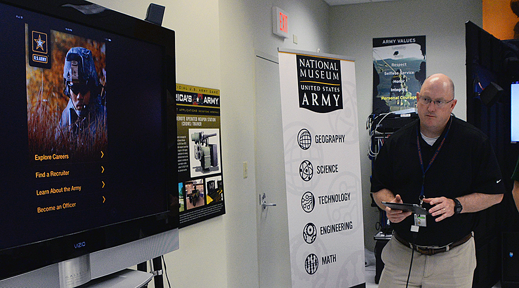 Jeff Sallas, Army Game Studio software engineer test lead and support, shows screens from the ‘Go Army Career Navigator’ application. (Photo by Clifford Kyle Jones / NCO Journal)