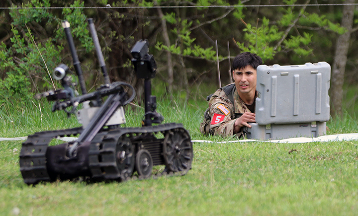 Sgt. 1st Class David Rizo controls a Talon mobile robot during the Best Sapper Competition at Fort Leonard Wood, Mo. (U.S. Army photo by Sgt. Anthony Hewitt)