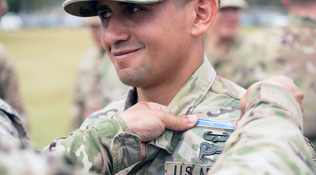 Sgt. Carlos Del Los Santos, Comanche Troop, 4th US Cavalry, 3rd Brigade Combat Team, 25th Infantry Division, receives his Expert Infantrymen Badge at Schofield Barracks, Hawaii. TRADOC Command Sgt. Maj. David Davenport is working on creating a similar badge, the Expert Action Badge, to signify proficiency at Soldier skills. (Photo by Spc. Patrick Kirby)
