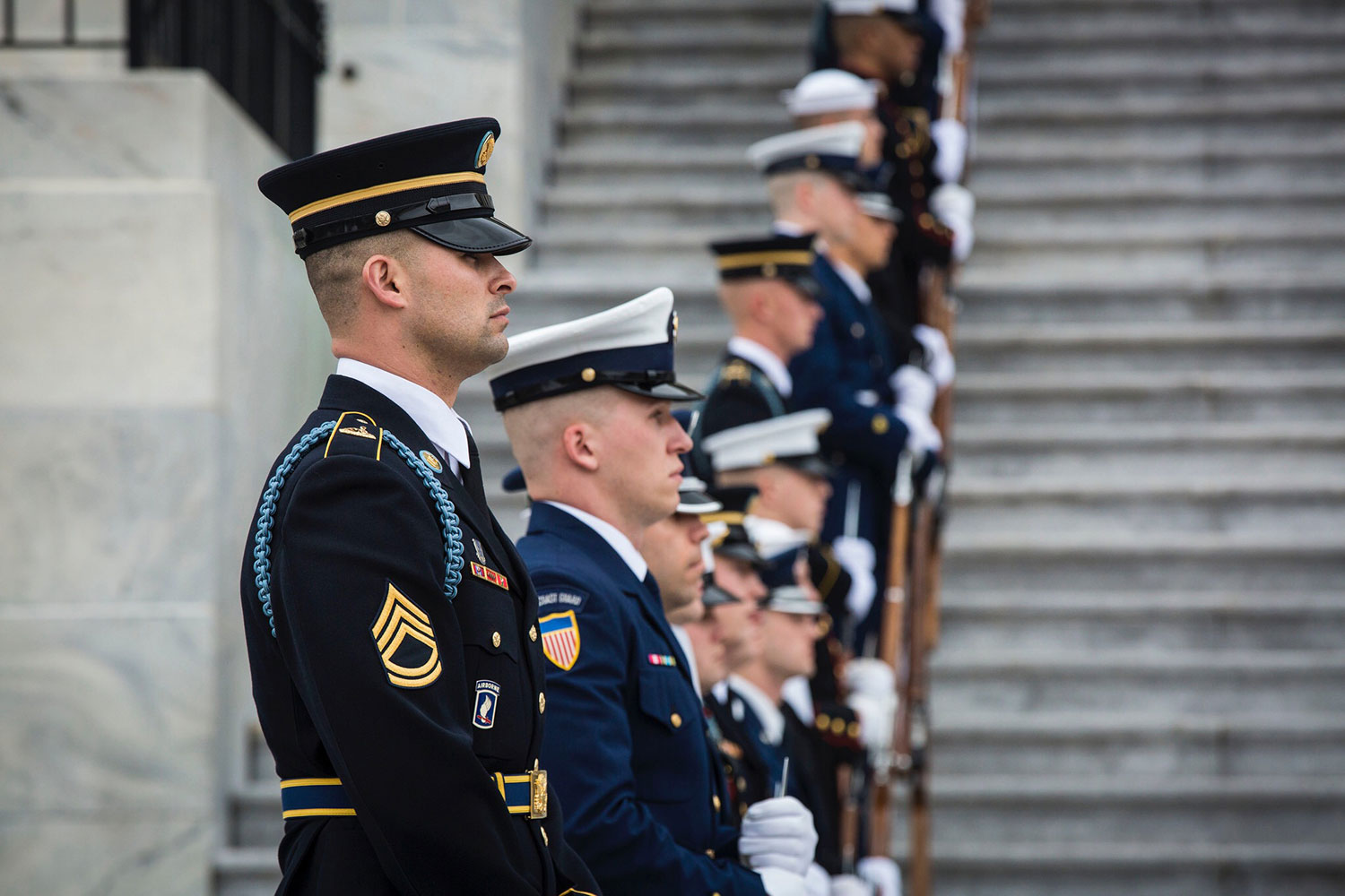 Sgt. 1st Class Christopher G. Taffoya, platoon sergeant for 3rd Platoon Honor Guard Company, stands at attention during the 58th Presidential Inauguration in Washington D.C., Jan. 20, 2017. More than 5,000 military members from across all branches of the armed forces of the United States, including Reserve and National Guard components, provided ceremonial support and Defense Support of Civil Authorities during the inaugural period. (Photo by U.S. Army Spc. William Lockwood)