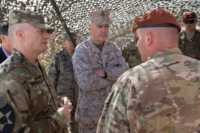 Army Command Sgt. Maj. John W. Troxell, left, senior enlisted advisor to the chairman of the Joint Chiefs of Staff, and Marine Corps Gen. Joseph F. Dunford Jr., center, chairman of the Joint Chiefs of Staff, listen to a brief during a visit to the North Camp in the Sinai Peninsula of Egypt. (Photo by D. Myles Cullen)