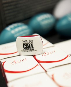 SAPR gifts are displayed on a table outside the SHARP Summit at Joint Base Elmendorf-Richardson, Alaska. The SHARP program reinforces the Army’s commitment to eliminate incidents of sexual harassment and sexual assault through awareness and prevention, training, victim advocacy, reporting and accountability. (Photos by Sachel Harris)