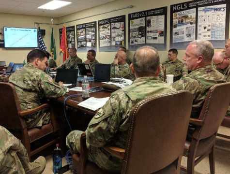 Brig. Gen. Richard K. Sele (far right), deputy commanding general, U.S. Army Civil Affairs and Psychological Operations Command (Airborne), receives a yearly training strategy brief from the 7th PSYOP Group. (U.S. Army photo by 1st Lt. David W. Cline)