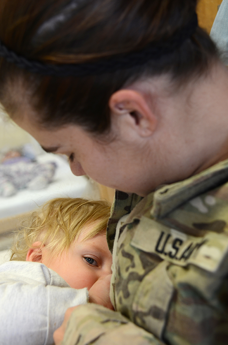 Cpl. Brittany Sandoval of 1st Battalion, 67th Armored Regiment, 3rd Brigade Combat Team, 1st Armored Division breastfeeds her 14-month-old daughter, Piper, before taking her home from a Child Development Center at Fort Bliss, Texas. Like many breastfeeding Soldiers, Sandoval visits the CDC on her lunch break to breastfeed her daughter. (Photo by Meghan Portillo / NCO Journal)