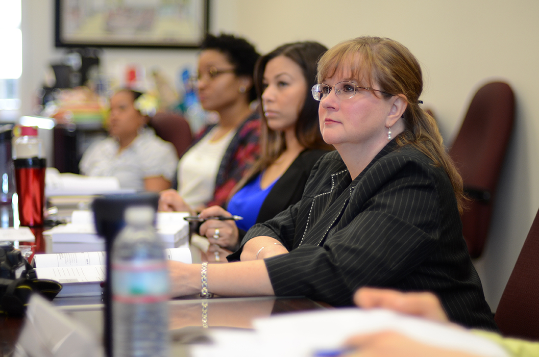Dody Myers, right, joins other spouses of USASMA students for a lecture on the American Red Cross. Throughout the Spouse Leadership Development Course, the spouses learn about programs available to Army families. (Photo by Meghan Portillo / NCO Journal)