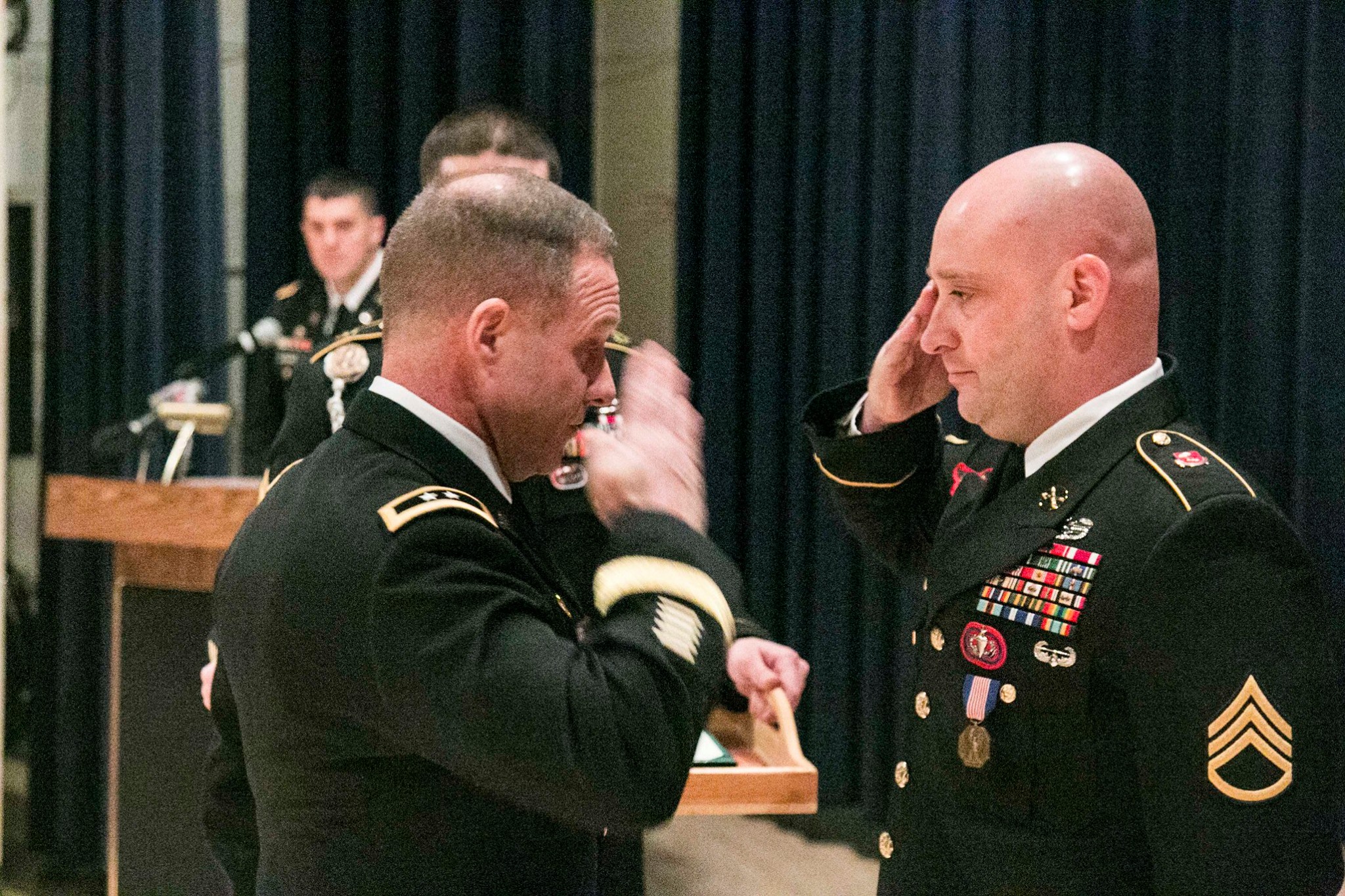 Staff Sgt. Joshaua Schneiderman, a forward observer with 2nd Battalion, 377th Parachute Field Artillery Regiment, 4th Infantry Brigade Combat Team (Airborne), 25th Infantry Division salutes Maj. Gen. Bryan Owens, commanding general of U.S. Army Alaska, during an awards ceremony at Joint Base Elmendorf-Richardson, Alaska. Schneiderman was awarded the Soldier’s Medal for risking his life during the rescue of a fellow fisherman from rapid waters in June 2014. (U.S. Army photo by Staff Sgt. Brian Ragin)