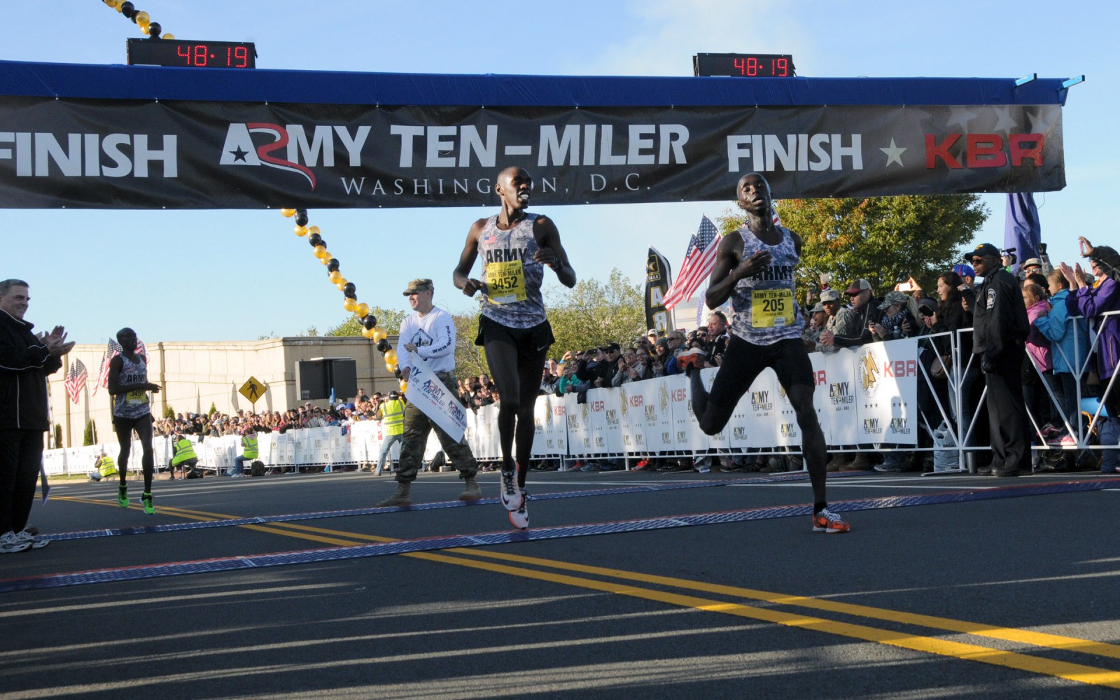 Soldiers and teammates Paul Chelimo and Nicholas Kipruto finish the Army Ten-Miler at 48:19 with Chelimo winning by seconds. Their teammate Shadrack Kipchirchir took third, Oct. 11, 2015, near the Pentagon in Arlington, Va. (Photo by Shannon Collins / U.S. Army)
