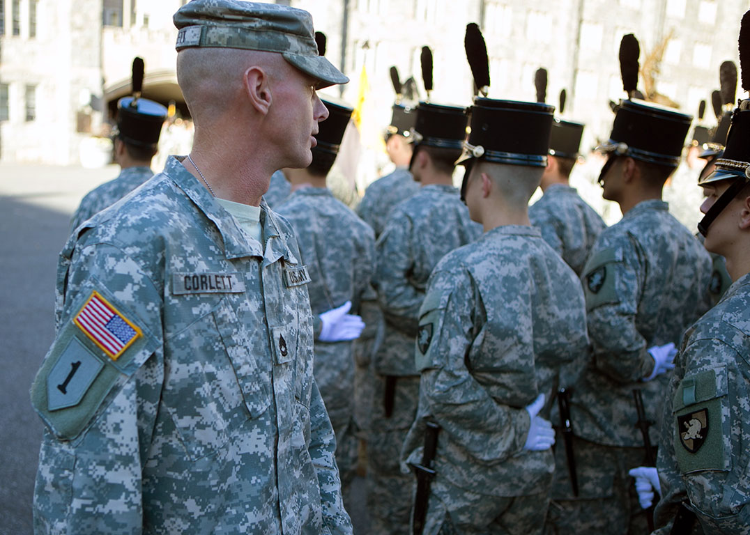 Sgt. 1st Class Stuart Corlett, Tactical NCO, 1st Regiment, Company E, inspects a cadet company prior to conducting drill and ceremony rehearsal for a regimental review on Oct. 6, 2015. The TAC NCO is expected to teach and supervise drill and ceremony, along with their other numerous duties, while assigned at the U.S. Military Academy. (U.S. Army photo by Sgt. 1st Class Jeremy Bunkley)