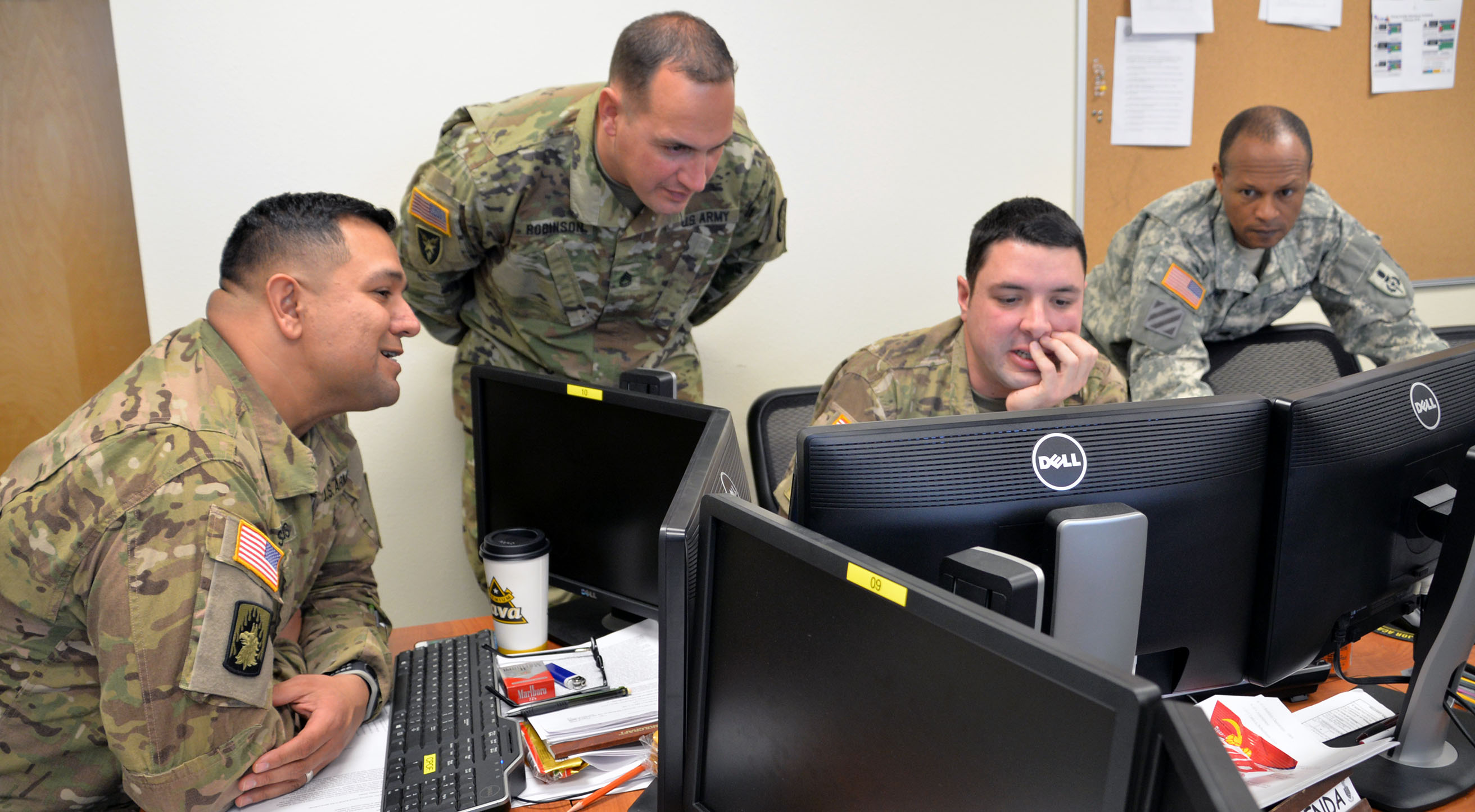 Students of the Battle Staff Noncommissioned Officer Course strategize during a class exercise in the spring. The military decision-making process is a culminating block of instruction in the course. (Photo by Martha C. Koester / NCO Journal)
